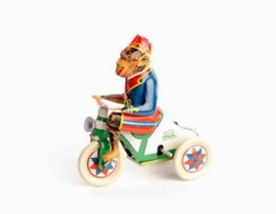 Plåt: Cyklande apa med nyckel